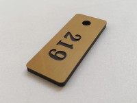 Брелок из пластика 50х17х3мм